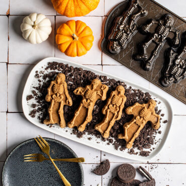 Spooky Skeleton Cakes on crumbled cookies