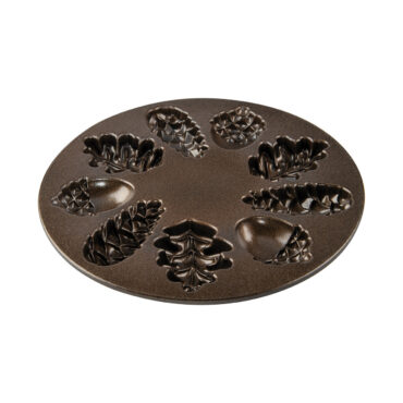 Nordic Ware Woodland Cakelet pan interior showing bronze nonstick coating and six tree-shaped cavities