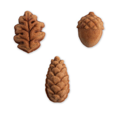 Nordic Ware white sweep of 3 cake designs found in the cast aluminum woodland cakelet, pine cone, oak leave, and acorn