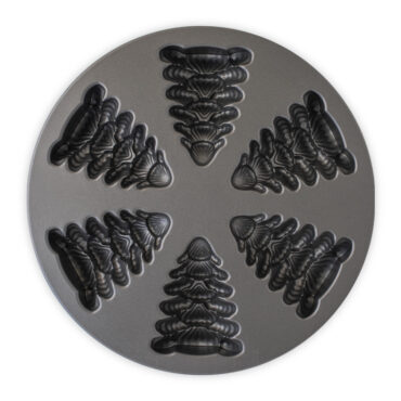 Nordic Ware Evergreen Cakelet Pan showing 6 tree-shaped cavities with dark nonstick interior coating