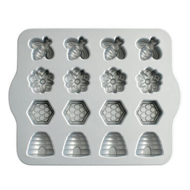 Nordic Ware Busy Bee Bitelet pan with 12 hexagonal bee-shaped cavities, toffee-colored nonstick interior