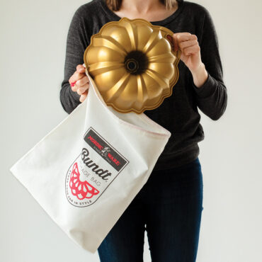 Bundt Storage Bag with logo on front and drawstring with person taking bundt out of bag