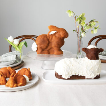 Chocolate lamb cake, 3D bunny cake, and mini bunny cakelets baked in Nordic Ware aluminum pans, decorated on plates