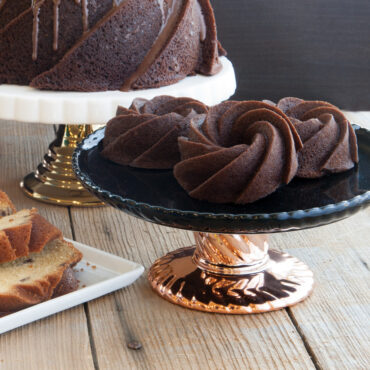 chocolate cakes baked in Nordic Ware Heritage Bundtlette pan, swirled fluted design, staged on pedestal