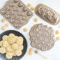 Group image of Busy Bee Bitelet Pan, Honey Hive Loaf Pan, Honeycomb Pull-Apart Pan, and plated Honey Bee Cookies.