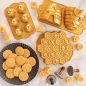 Bee-themed bakeware group image, baked cookies on plate, cakes on surface and product