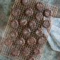 Baked chocolate cookies on grid