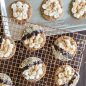 Baked s'more cookies on grid, sheet pan