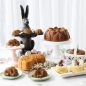 Easter baking display with basked Magnolia Bundt and other treats