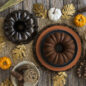 Fall table set up with Spice Bundt cake on platter and bronze pan next to it.