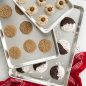 Variety of baked cookies on different size baking sheets in set