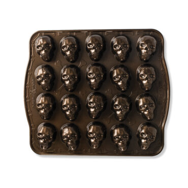 Nordic Ware aluminum cakelet pan with 20 skull-shaped cavities, silver finish, arranged in 4 rows of 5