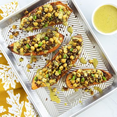 Quinoa and Chickpea Stuffed Sweet Potatoes with Curry Peanut Sauce