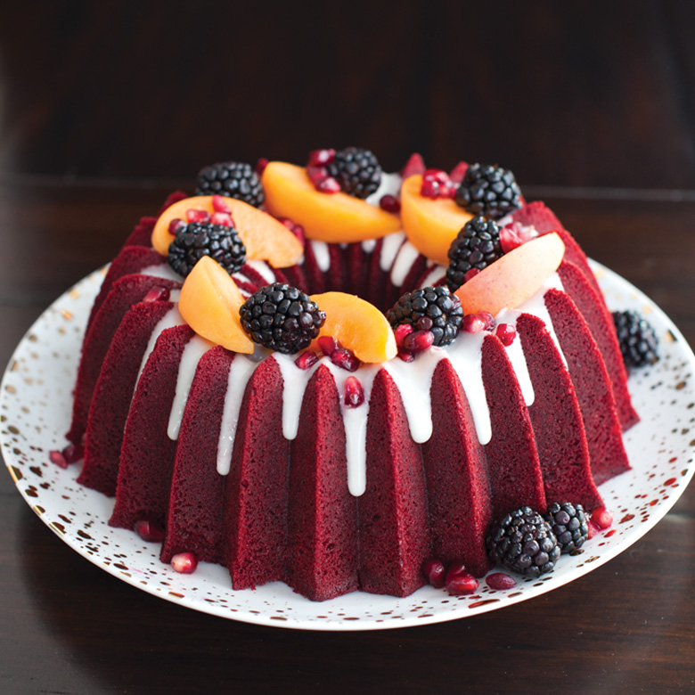 Red Velvet Bundt Cake with Cream Cheese Icing and rasberry toppings 