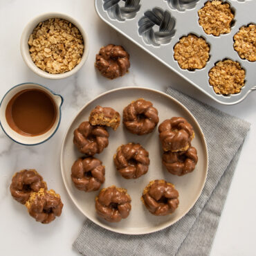 plated peanut butter cereal bars with a chocolate glaze made with nordic ware braided mini bundt pan