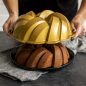 75th Anniversary Braided Bundt® Pan removing from baked cake