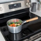 Naturals 3QT Sauce Pan on stove with veggies