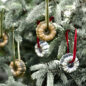 Bundt® Collectible Ornament hanging on tree, up close
