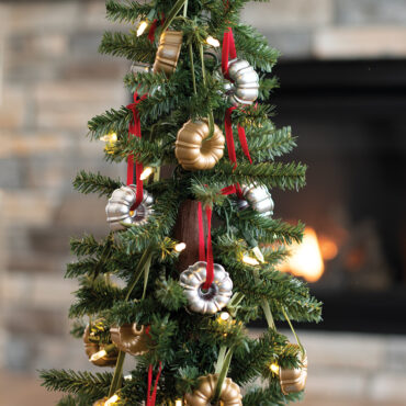 Ornaments on tree near fireplace