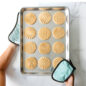 Hot Pads holding cookie sheet with baked cookies