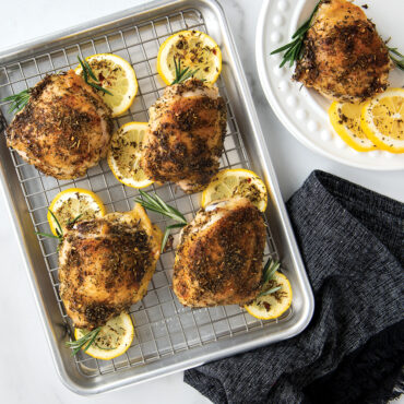 Naturals® Quarter Sheet with Oven-Safe Nonstick Grid with lemon chicken.