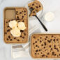 Naturals® Nonstick Eighth Sheet with baked cookie and ice cream, cut along with a whole sheet pan cookie next to it.