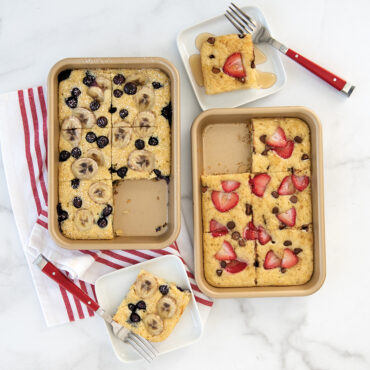 Two Naturals® Nonstick Eighth Sheets with baked pancakes with an assortment of fruit toppings.