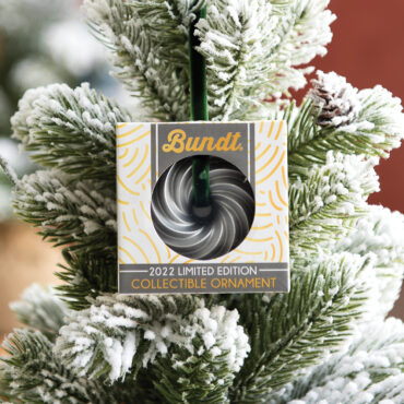 Silver Heritage Bundt ornament in its box on hanging on small Christmas tree