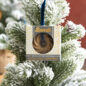 Packaged Heritage Bundt ornament hanging on Christmas tree
