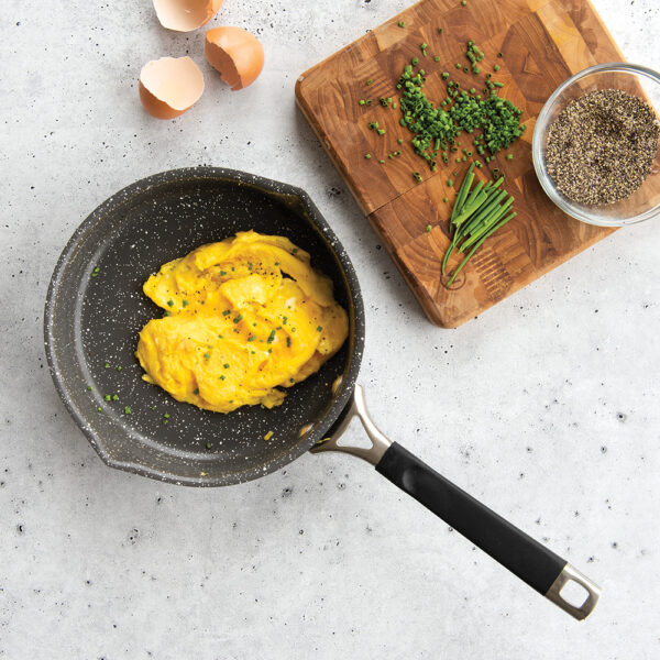 A overhead image of scrambled eggs in the 8" ceramic coated skillet ready to be served.