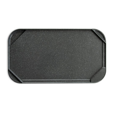 An image of the smooth side of the reversible griddle on a white background