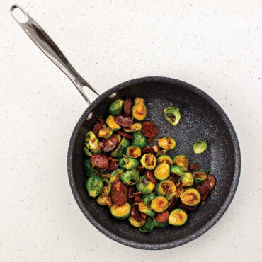 An overhead image of the 10" Saute Skillet with cooked vegetables placed in the pan.