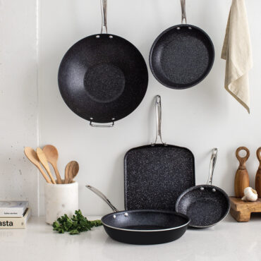 Basalt Ceramic Cookware Collection showcasing 5 pieces in a beauitful kitchen scene. Made without PFAS and aluminum construction.