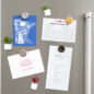 Featuring our magnets adorning a fridge. These magnets not only add a splash of color and style to your kitchen, but they also hold up notes, recipes, and other important reminders. With their intricate Bundt cake designs,