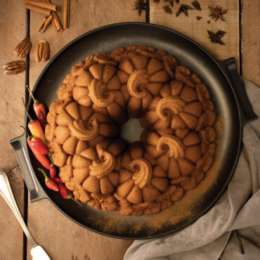 The image showcases a stunning overhead view of the Pumpkin Patch Bundt cake.