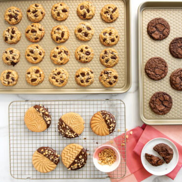 Baked cookies on two baking sheet and baking rack