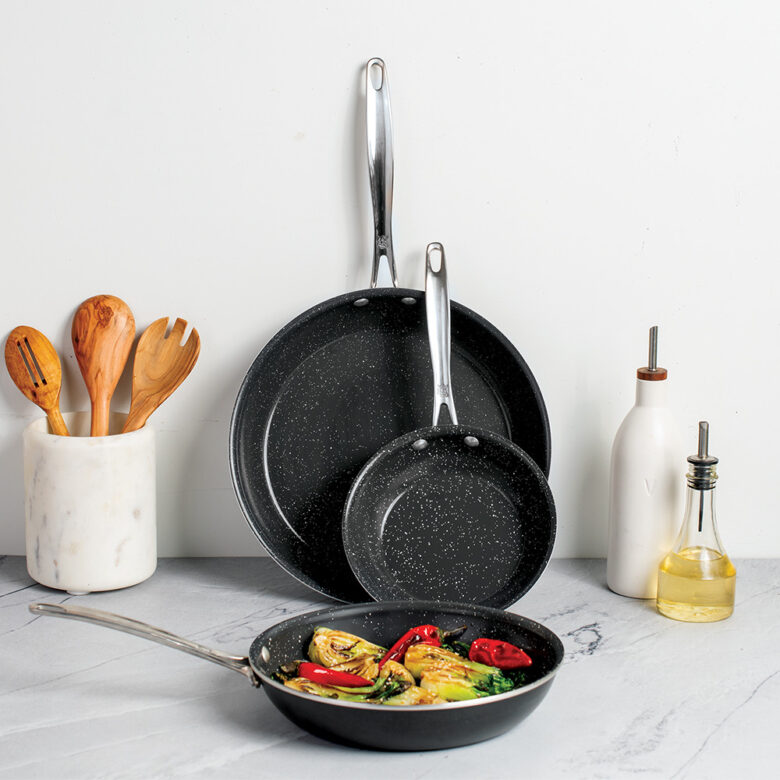 Lifestyle image of Basalt 3 Piece Frying Pan Set, one pan with food in it