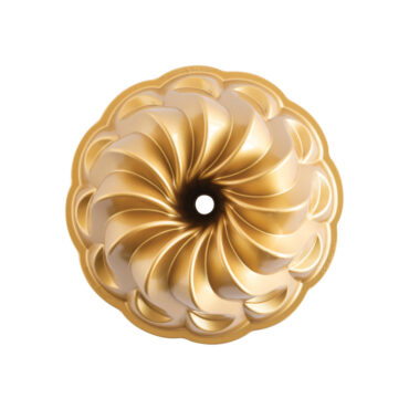 Nordic Ware Pirouette cast aluminum bundt pan with elegant swirled fluted design and golden exterior