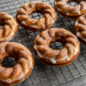 Baked French Twist Donuts glazed on rack