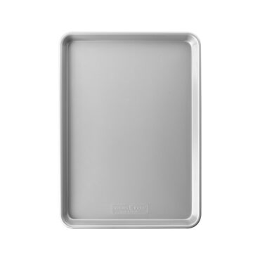 Nordic Ware aluminum half sheet baking pan, rectangular with raised rim, natural silver finish, overhead interior view