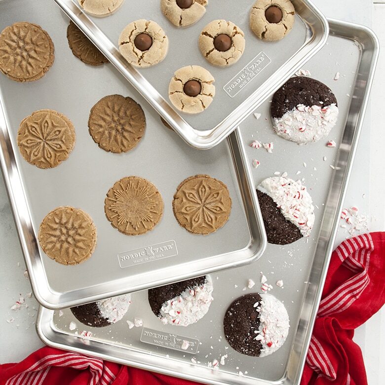 Holidays cookies on three naturals half sheets