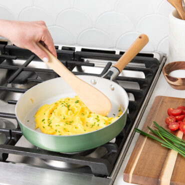 Nordic Ware 10-inch cardamom ceramic nonstick skillet on stovetop with creamy mashed potatoes being stirred
