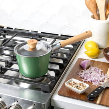 Cardamom 1.5Qt Saucepan on stovetop with lid on pan