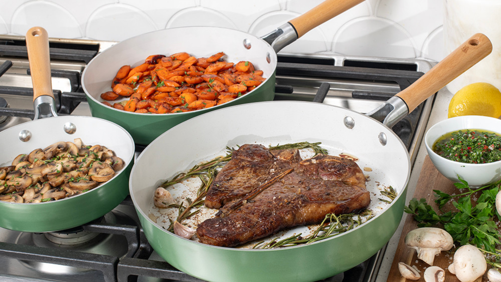 Three Cardamom Nonstick Ceramic Skillets cooking food on a stovetop. 