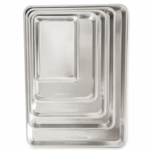 Naturals aluminum bakeware sheet pan size comparison image. 