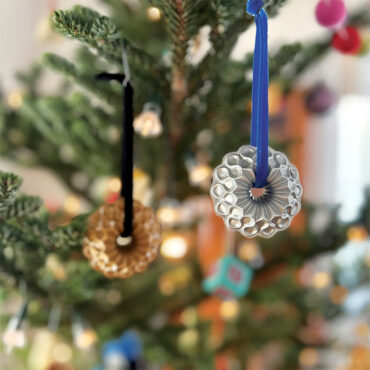 Silver and Gold Crown Bundt Ornaments hung on Christmas Tree
