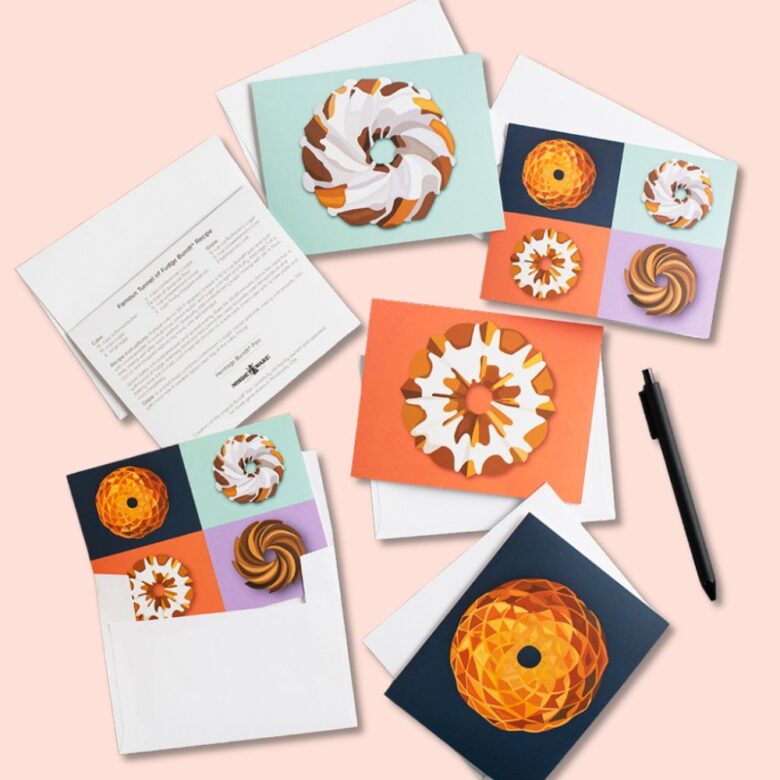 Image of Nordic Ware Greeting Cards with Bundt illustrations, pen and pans in background