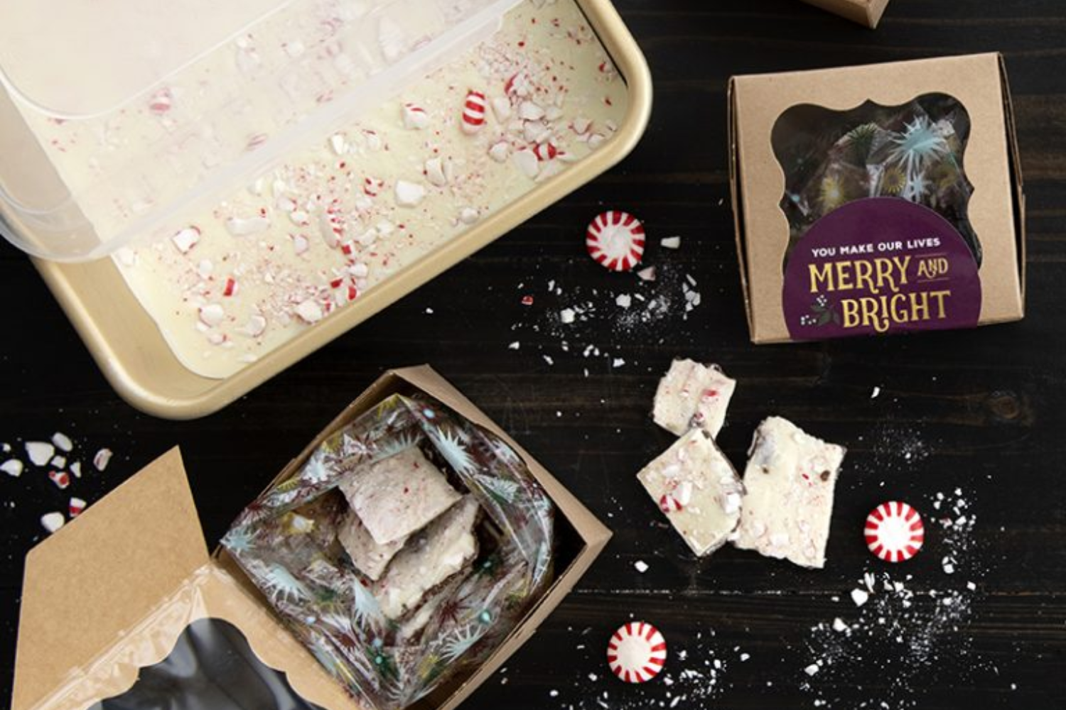 Peppermint Bark in a baking pan with a lid with peppermint bark broken up and boxed for holiday gifting. 