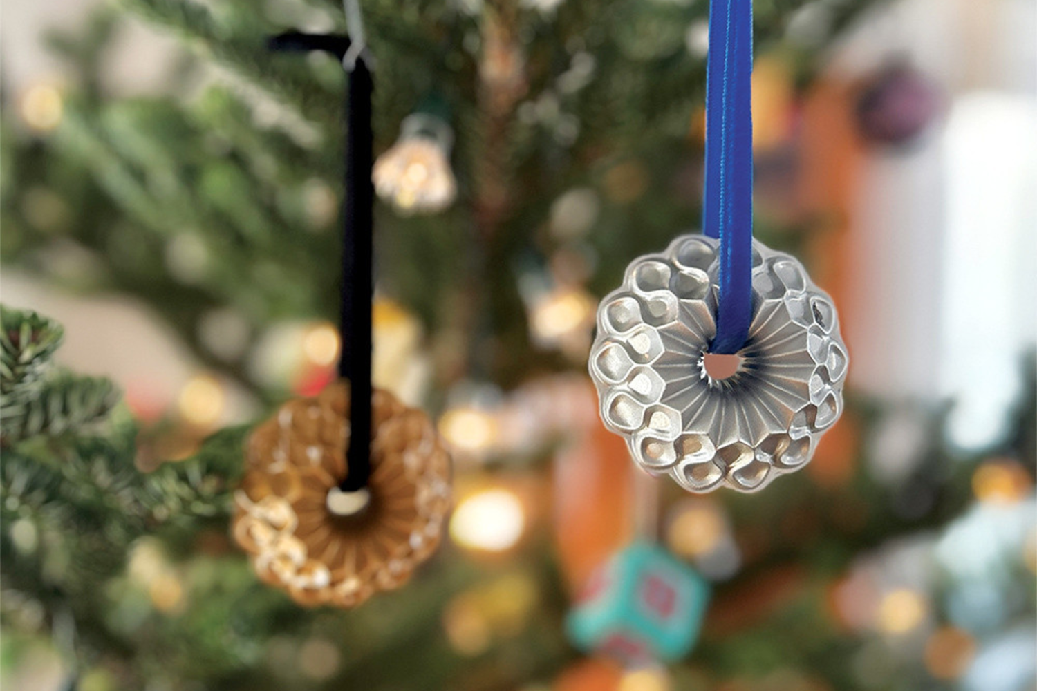 Crown Bundt ornaments hanging from a Christmas tree. 