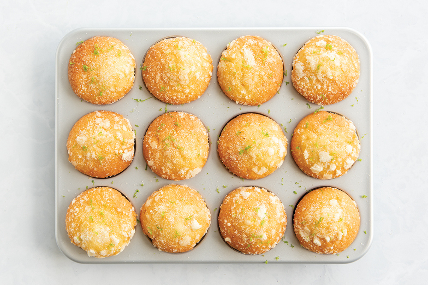 Brilliant Bakeware Nonstick Muffin Pan Coconut and lime muffin in a 12-Cup Brilliant Bakeware Nonstick Muffin Pan.